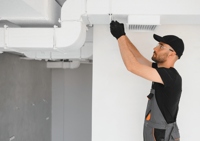 HVAC ductwork runs being installed overhead