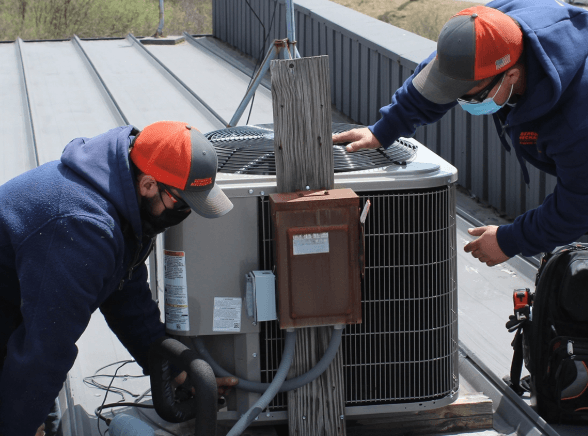 Technician checking pressures on an air conditioning system